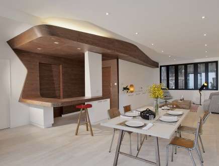 Photograph of Ground and First Floor living and dining room (incl. built-in wood bar and cabinetry). Photo: Margotpolo Productions Ltd.